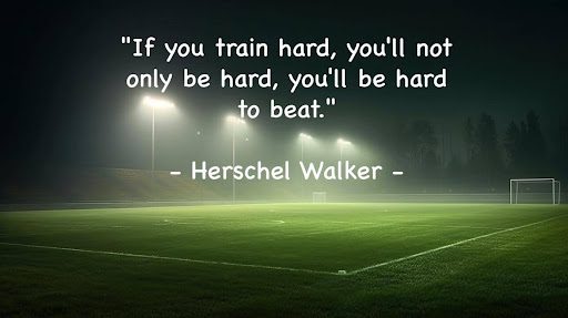 A picture of some grass field with a quote by herschel walker.